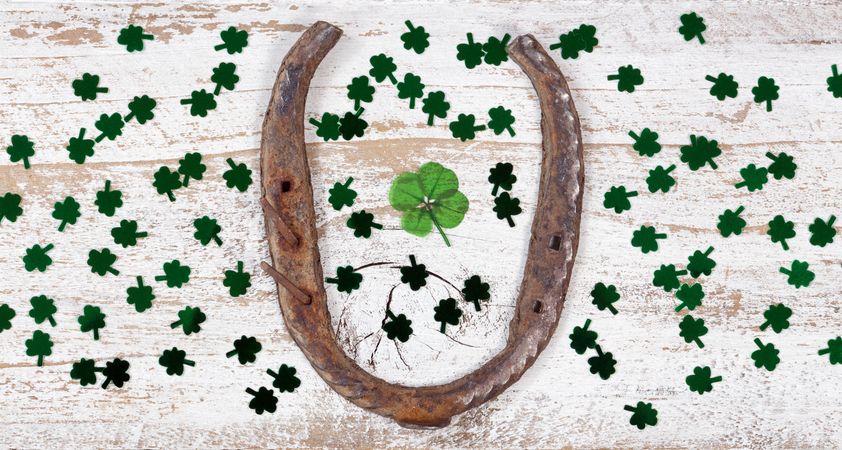 St Patrick Day lucky items on rustic wood