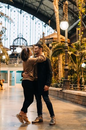 Happy couple hugging in pavilion