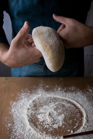 Crop man preparing Rosca de Reyes