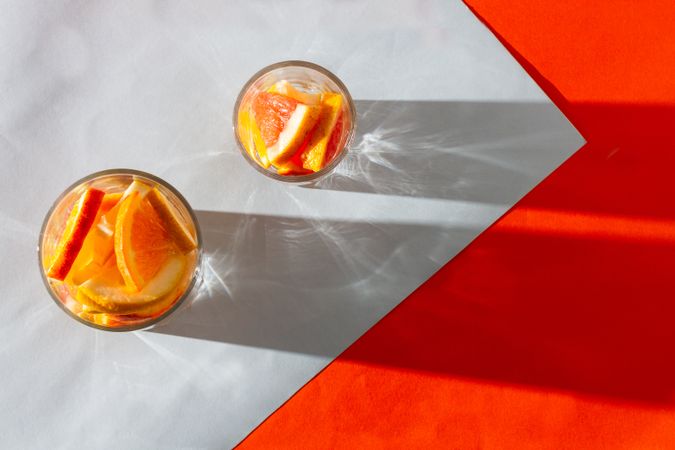 Sliced citrus fruits in glasses