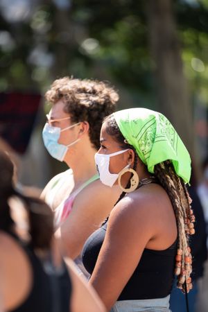 Los Angeles, CA, USA — June 16th, 2020: two people listening to speakers at protest demonstration