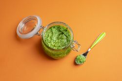 Pesto sauce in an open jar