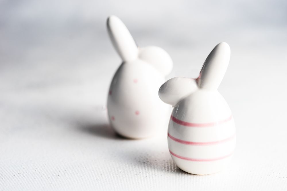 Easter concept with rabbit figurines on table