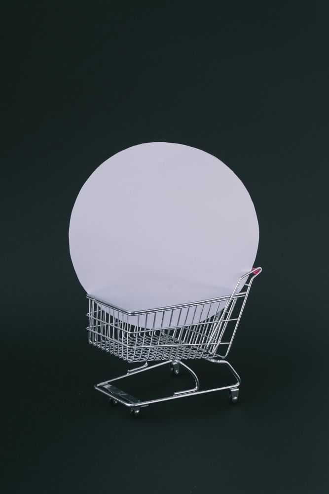Shopping cart with circular box on dark background