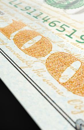 One Hundred Dollar Bills Close-up Abstact.