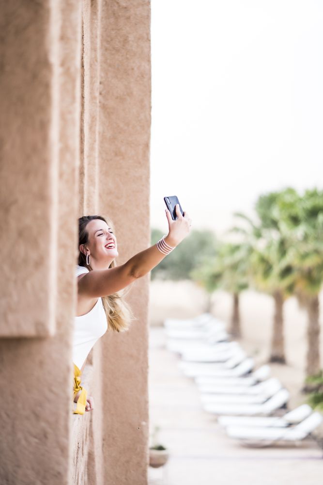 Woman making a selfie in balcony