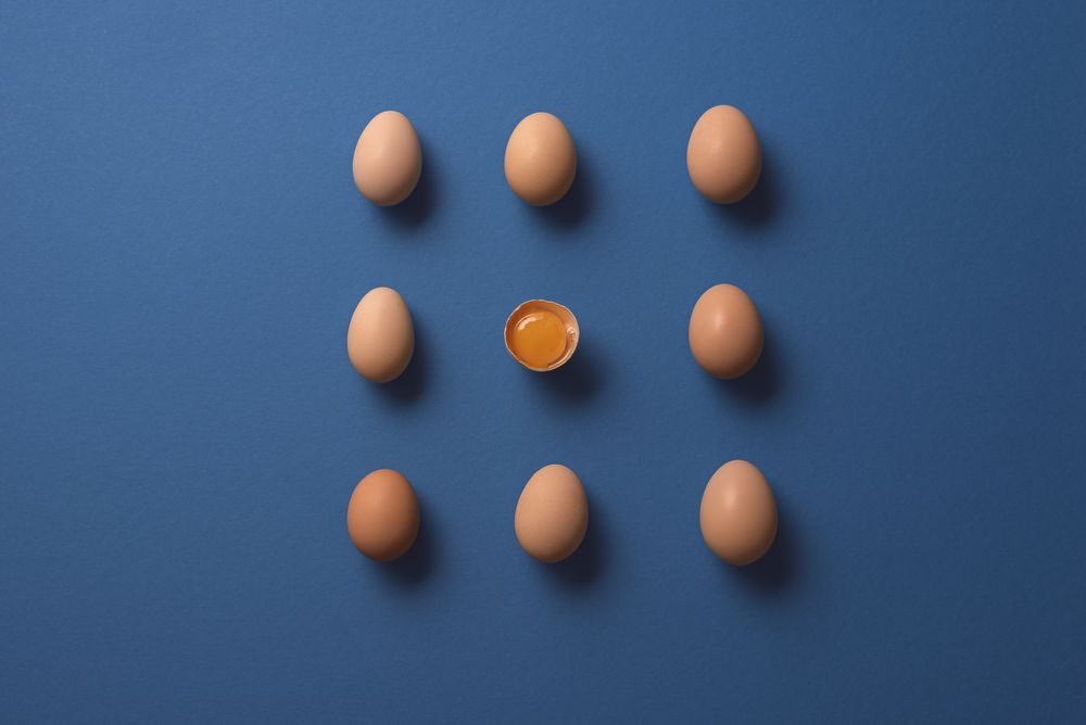Whole eggs in perfect pattern with one cracked egg