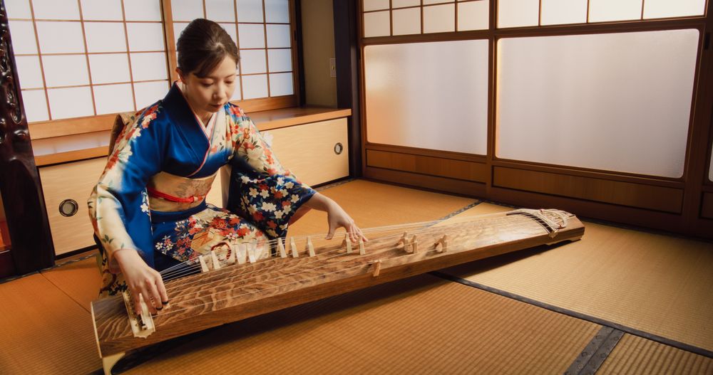 Authentic Japanese Koto Player Practicing the Art of String Music in Her Traditional Home.