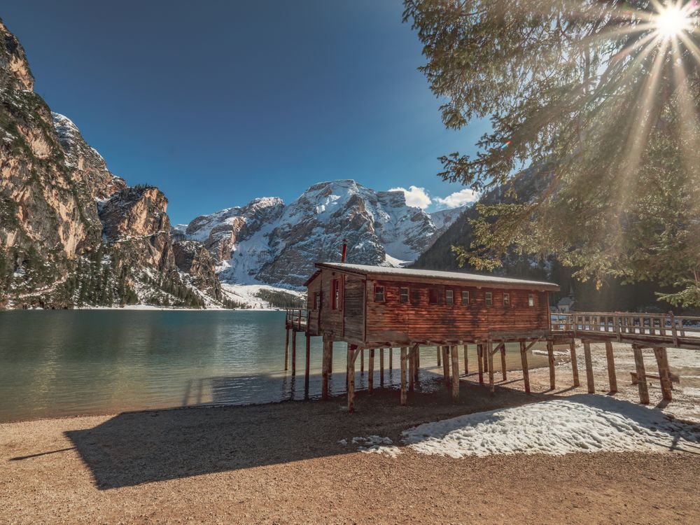 Wooden house on stilts on serene lake