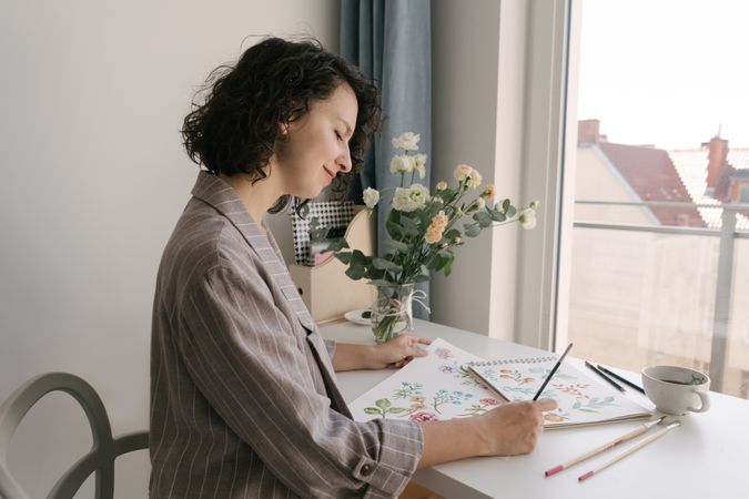 Woman painter working at home