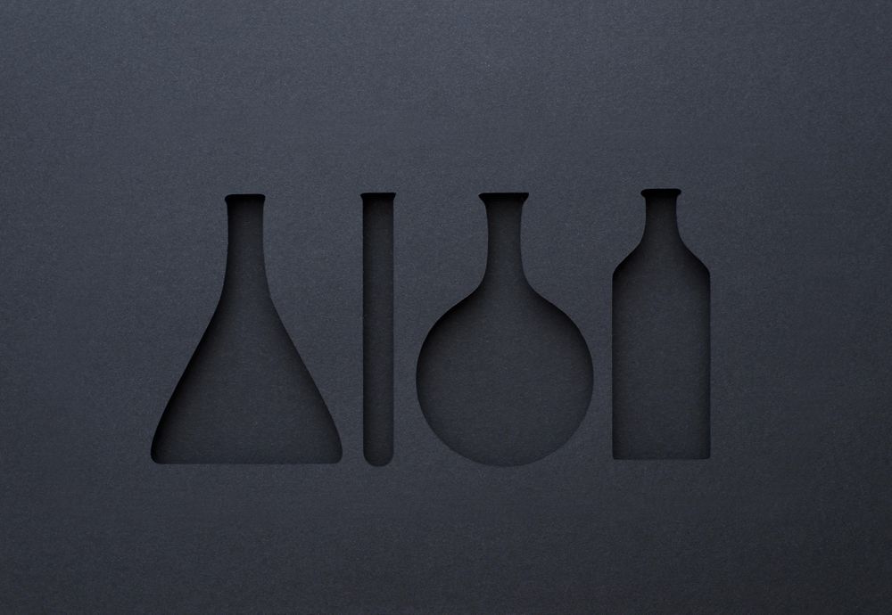 Silhouette cut outs of chemistry tools with paper