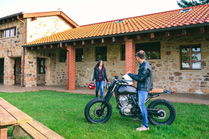 Man waiting his girlfriend on motorcycle
