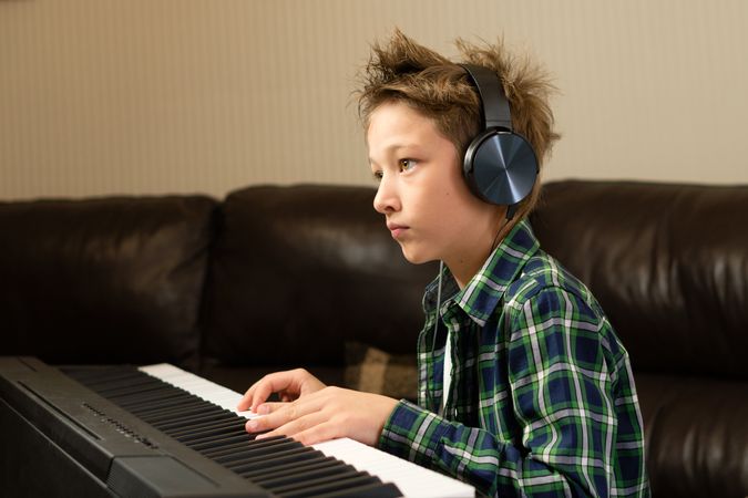 Focused Child Playing Piano