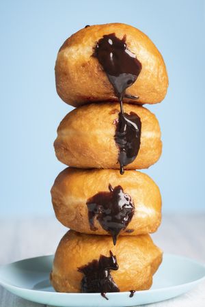 Chocolate filled doughnuts stacked