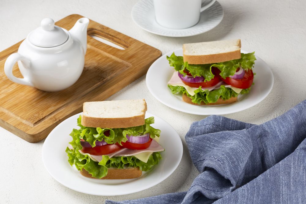 Natural sandwich. Sandwich with cheese, ham, lettuce, tomato and red onion.