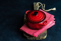 Cooking with cast iron pan on kitchen towel