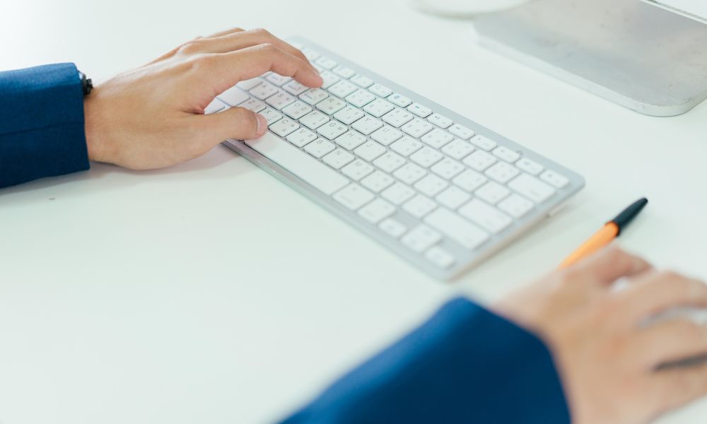 Hands with bright computer keyboard