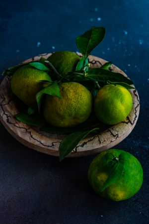 Bowl of fresh green tangerines