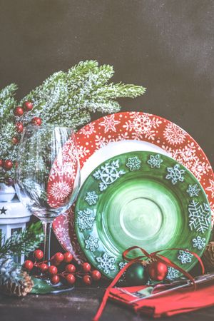 Green and red plates for Christmas season presented on table