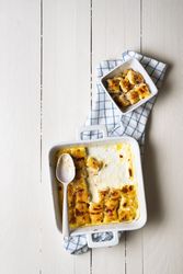 Serving portion of gratin cheese gnocchi