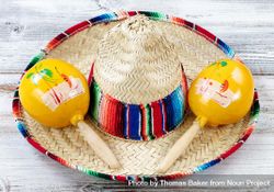 Close up view of traditional Cinco De Mayo objects on white weathered wood 0WgpP0