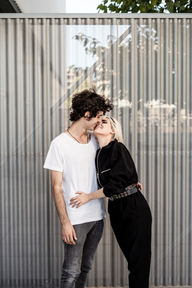 Couple near stripped modern building