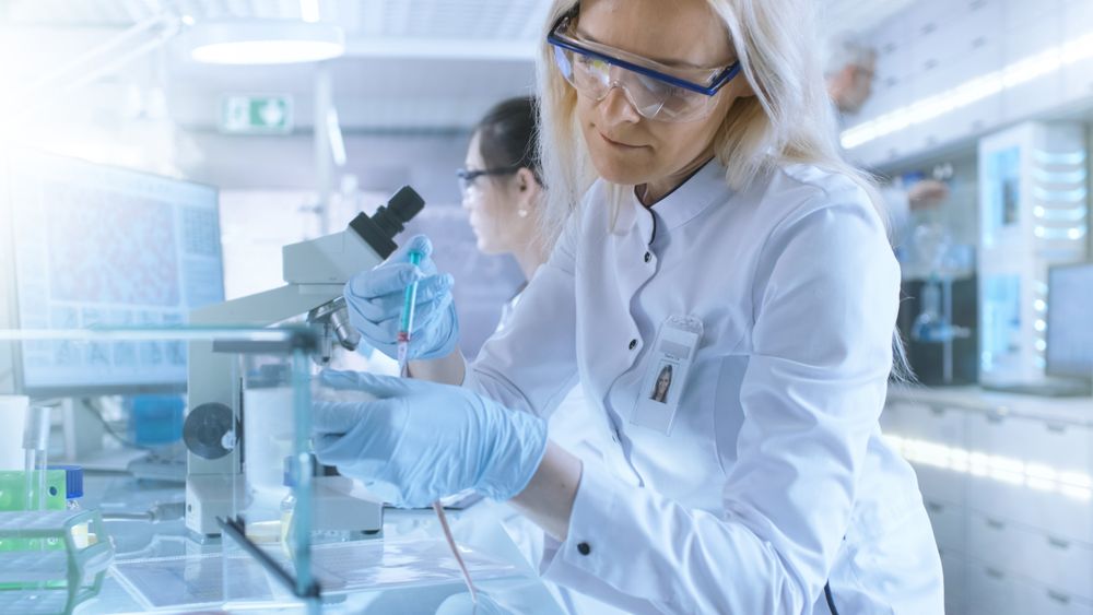 Medical Research Scientist Tests Vaccine Experimental Drug on a Laboratory Mouse Injecting it with Syringe.