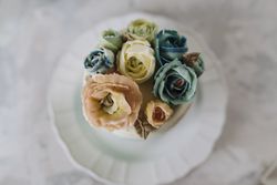 Buttercream flowers cake, blue and pastel peach colors