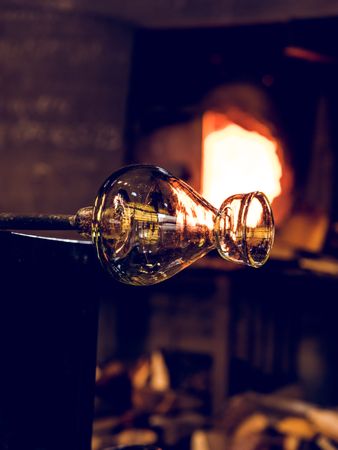 Shiny glass vase with pipe