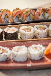 Delicious set of sushi on ceramic trays