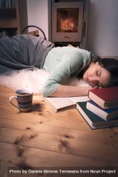 Sleeping woman surrounded by books 4AOk60