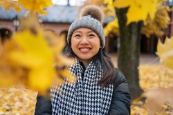 Happy female tourist enjoying autumn in Oslo