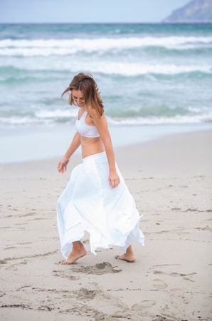 woman dancing near sea