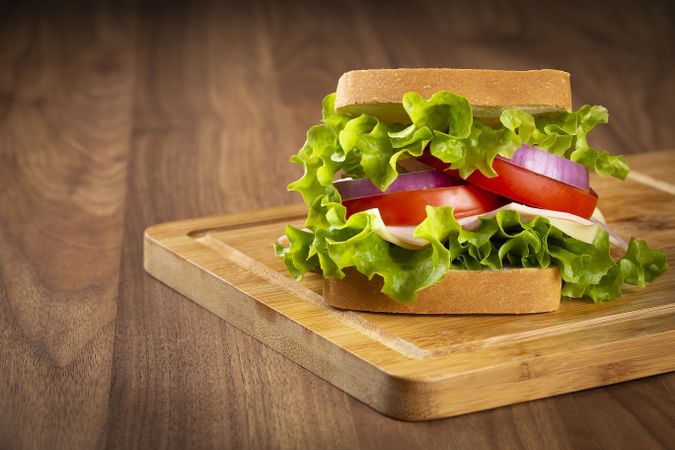 Natural sandwich. Sandwich with cheese, ham, lettuce, tomato and red onion.