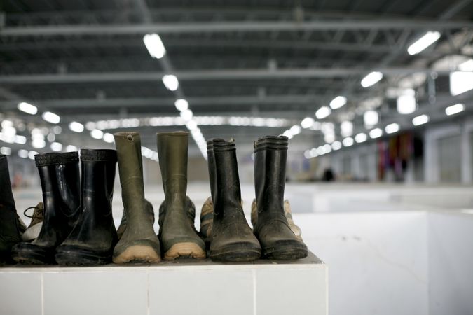 Rubber boots on top of shelf in shop