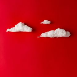 Clouds on red background