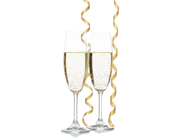 Champagne glasses and ribbons isolated on light background