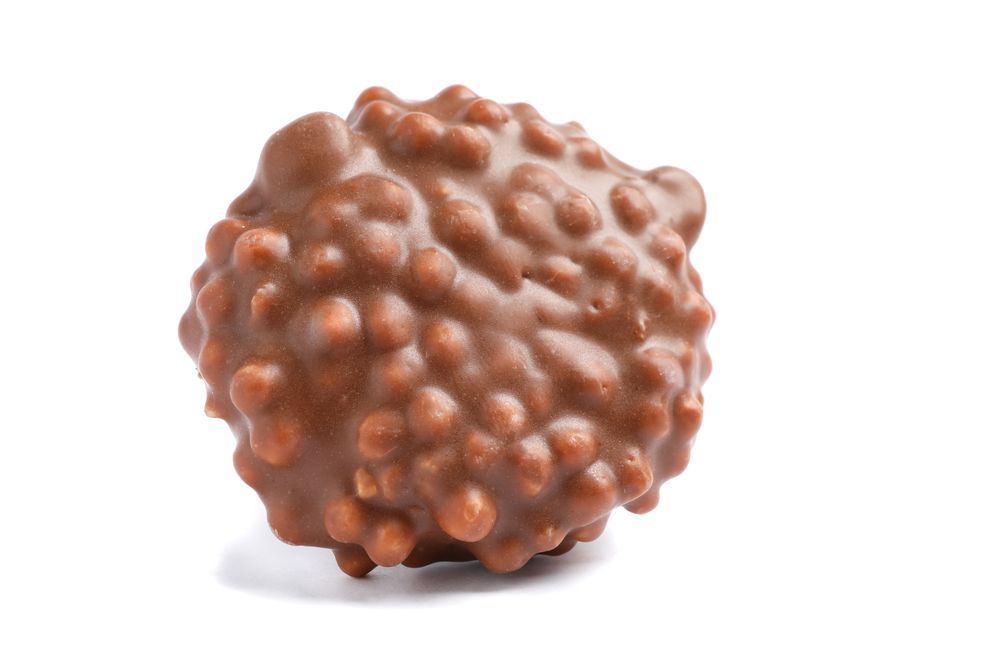 Chocolate cookie with caramel filling isolated on plain background