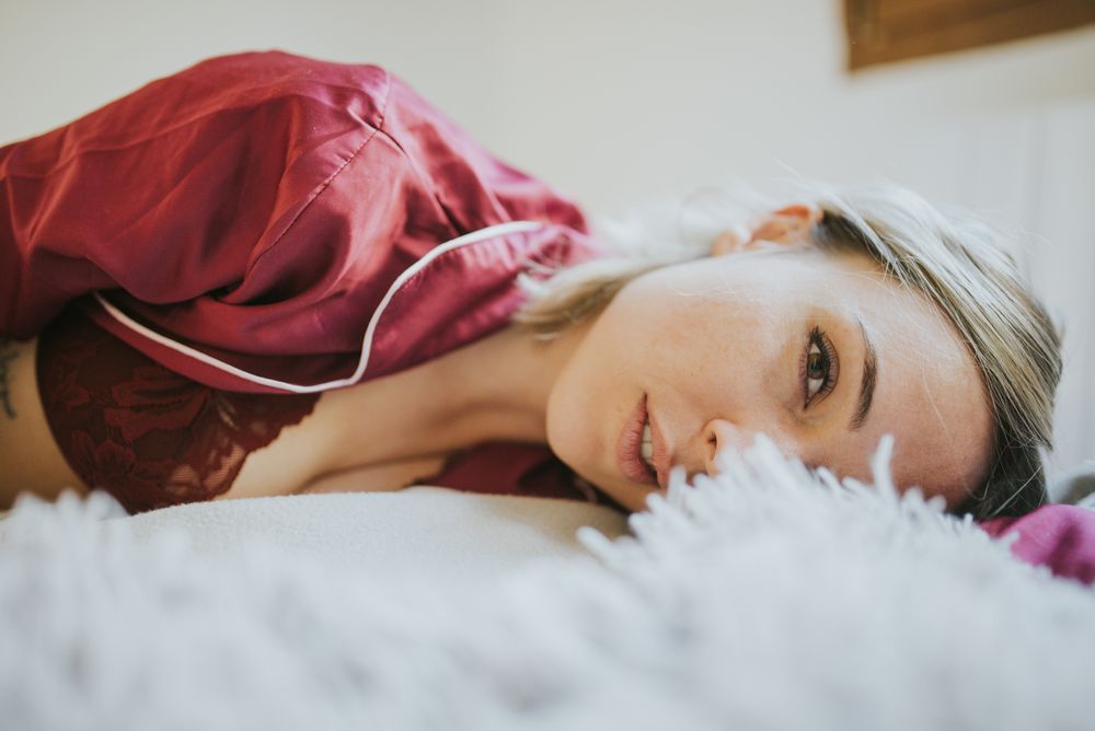 Woman and smiling in bed