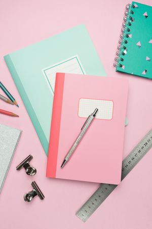 School stationery set on pink background