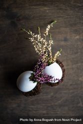 Heather in decorative eggs on wooden table with copy space 0yXx2L