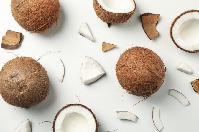 Flat lay with coconut on plain background, top view