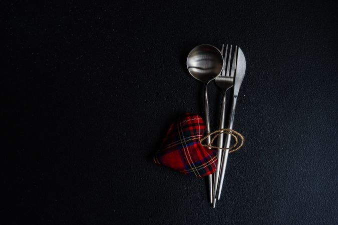 Cutlery set for St. Valentines day with felt tartan heart