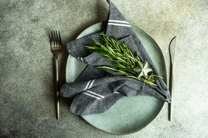 Table setting with fresh rosemary