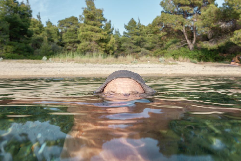 Man swimming under water in sea