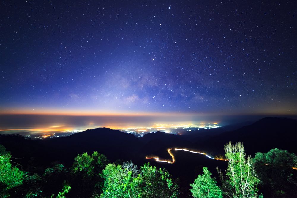 Starry night sky at Monson viewpoint Doi AngKhang and milky way galaxy with stars and space dust in the universe