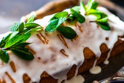 Close up of mint garnish of freshly baked lemon cake dessert