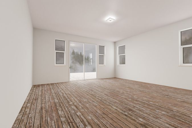 Raw Unfinished Room of House with Blank Walls and Worn Wood Floors.
