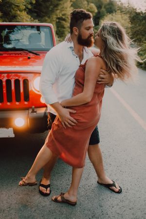 Loving couple dancing on road