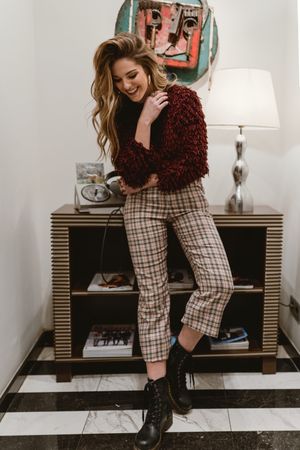 Cheerful woman in stylish room